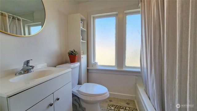 bathroom featuring vanity, tile patterned floors, and toilet