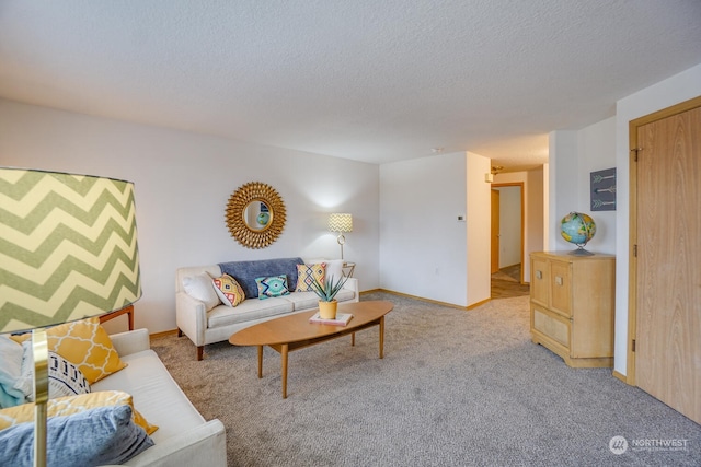 living room featuring light colored carpet and a textured ceiling