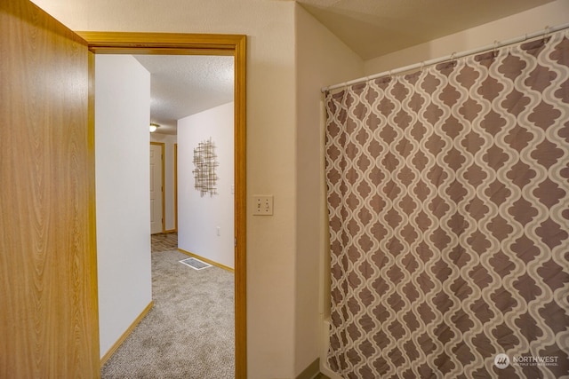 bathroom with a textured ceiling