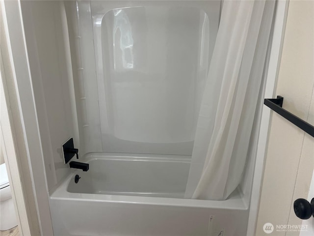 full bathroom featuring shower / bathtub combination with curtain