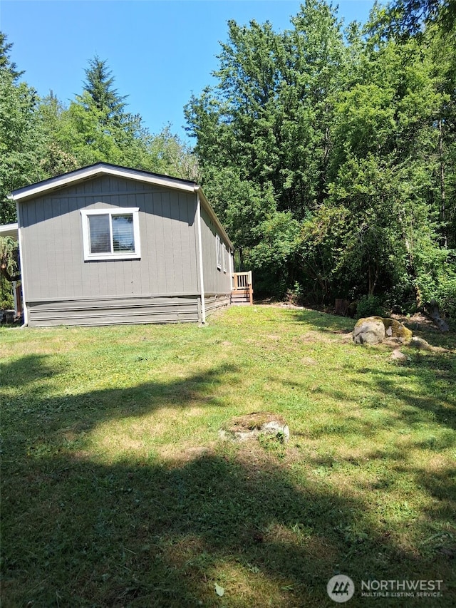 5591 Bethel Rd SE Unit 8, Port Orchard, WA 98367 - view of property exterior featuring a lawn