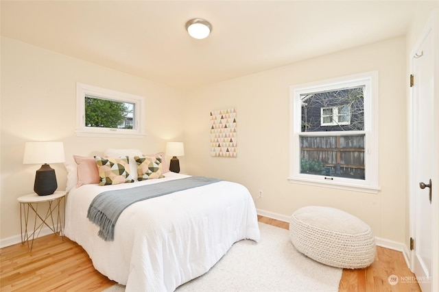 bedroom with hardwood / wood-style flooring