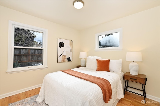 bedroom with light wood-type flooring