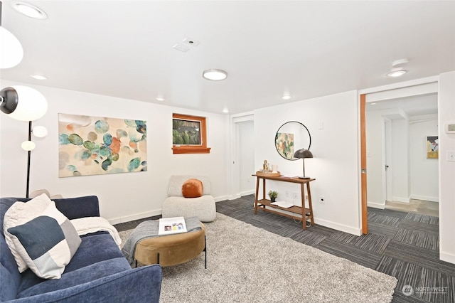 living room featuring dark colored carpet