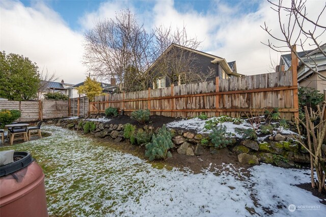 view of yard covered in snow