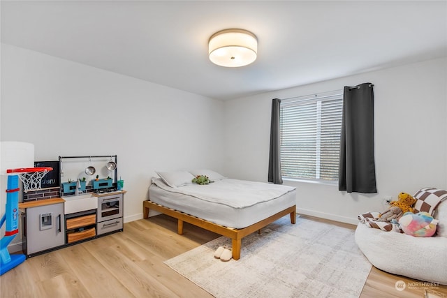 bedroom featuring light wood-type flooring