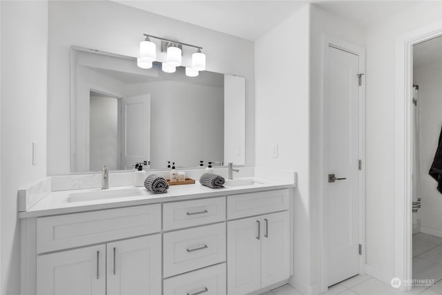 bathroom with vanity and tile patterned flooring