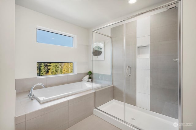 bathroom with separate shower and tub