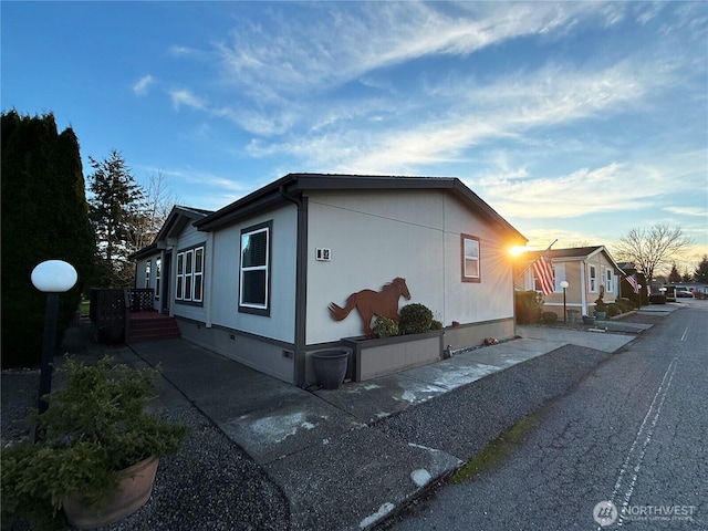 view of side of property featuring crawl space