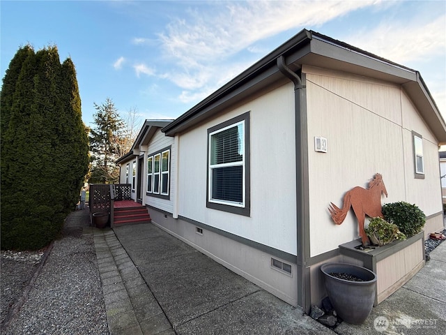 view of home's exterior featuring crawl space