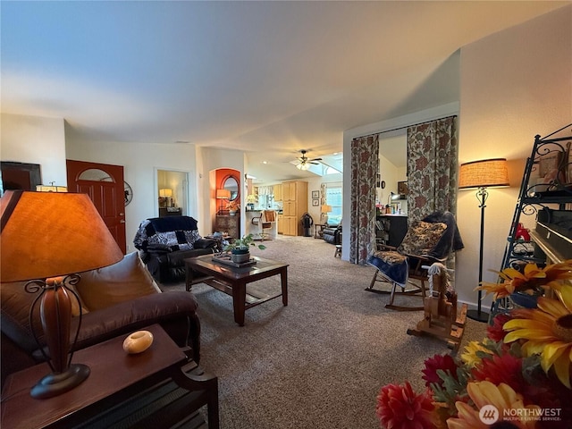 carpeted living room with a ceiling fan