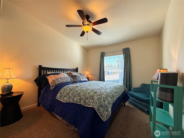 carpeted bedroom with a ceiling fan, vaulted ceiling, and baseboards