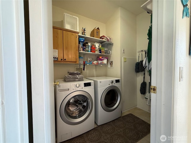 laundry area featuring cabinet space and washer and dryer