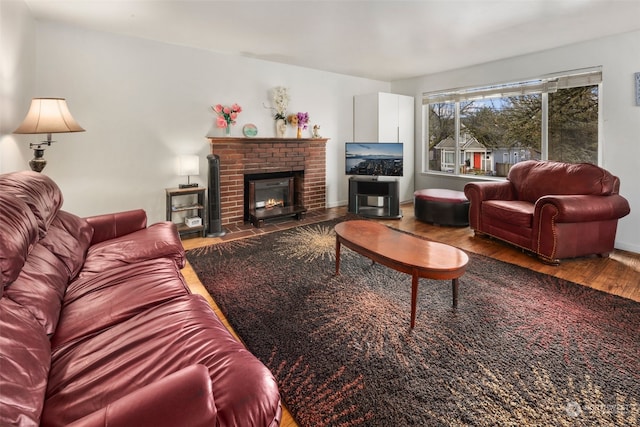 living room with hardwood / wood-style floors and a fireplace