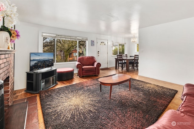 living room featuring wood-type flooring and a fireplace