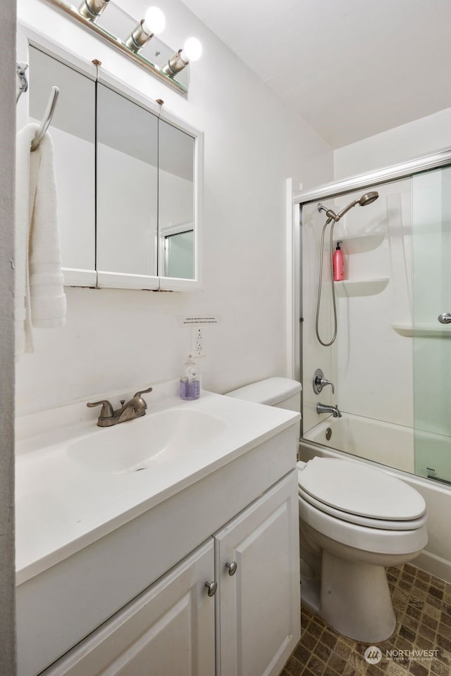 full bathroom featuring vanity, enclosed tub / shower combo, and toilet