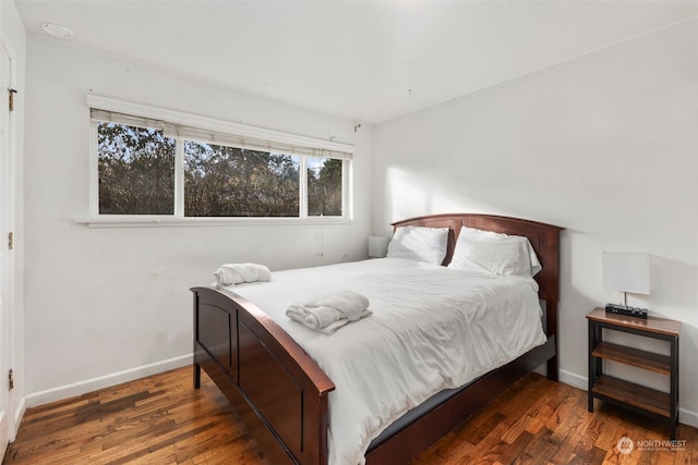 bedroom featuring dark wood-type flooring