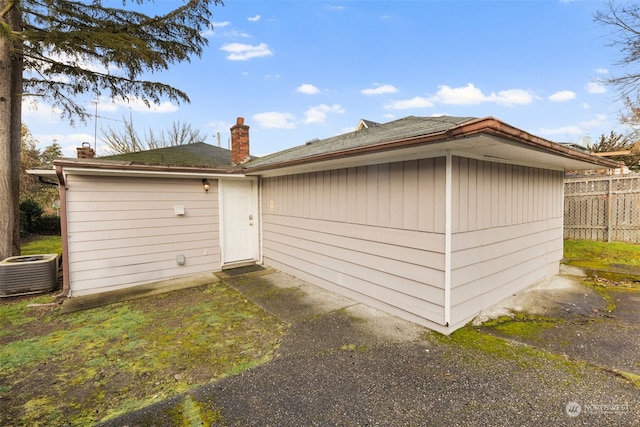 back of house with cooling unit