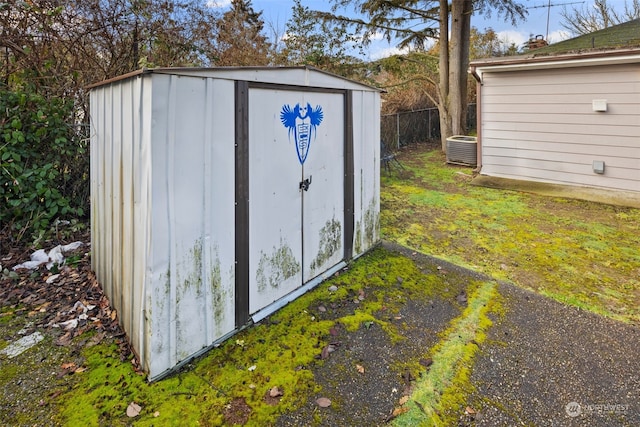 view of outdoor structure featuring central AC