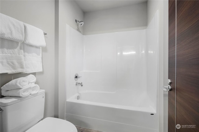 bathroom with shower / bath combination and toilet