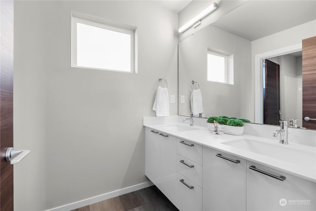 bathroom featuring vanity and hardwood / wood-style floors