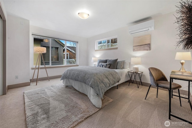 carpeted bedroom with baseboards and a wall mounted air conditioner