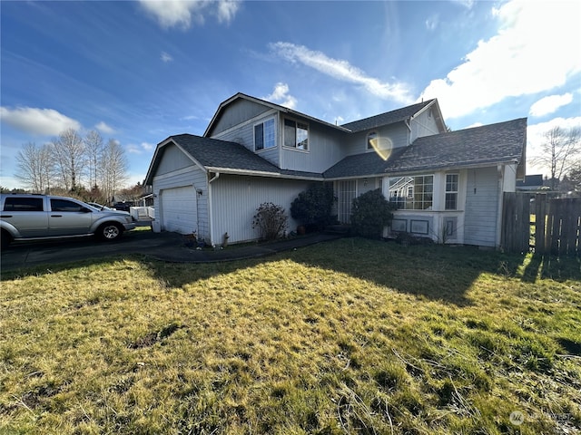 view of side of home featuring a garage and a lawn