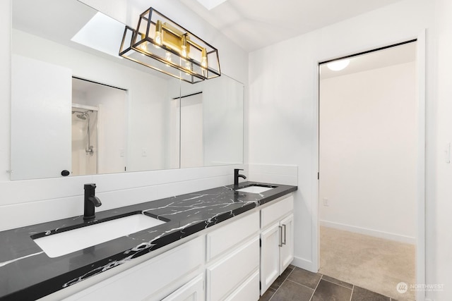 bathroom featuring vanity and tile patterned flooring