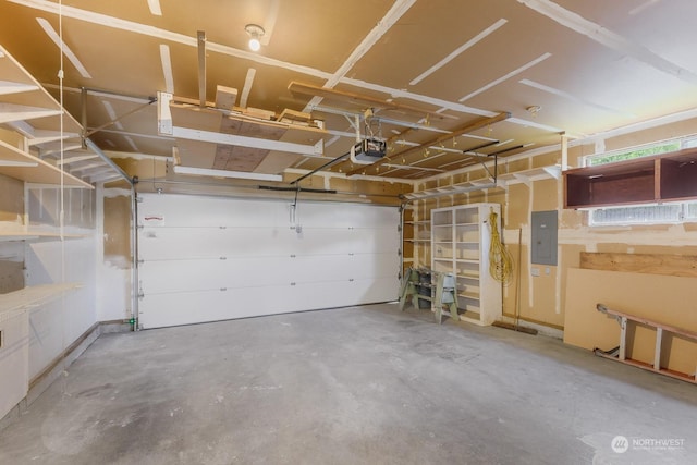 garage featuring a garage door opener and electric panel