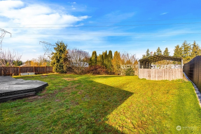 view of yard featuring a carport