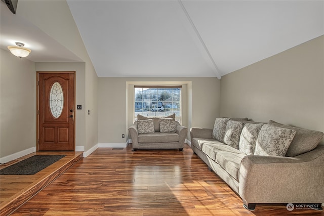 living room with wood-type flooring and lofted ceiling