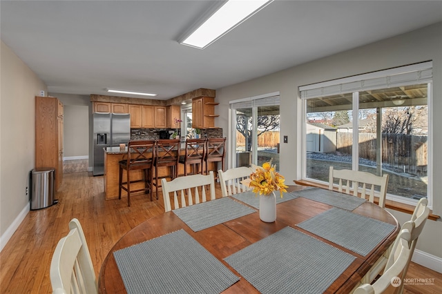 dining room with light wood-type flooring