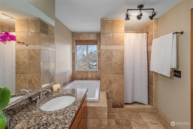 bathroom featuring vanity and shower with separate bathtub