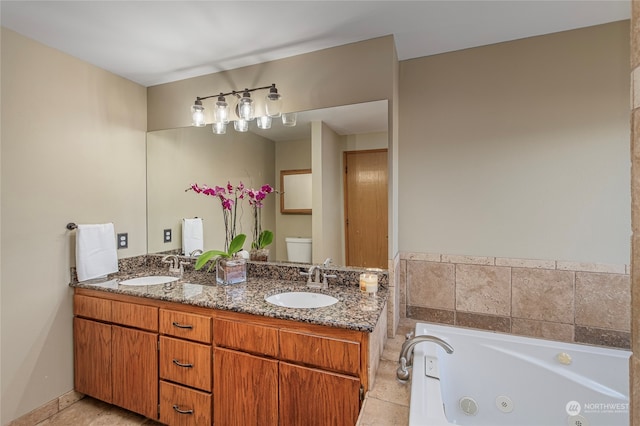 bathroom with a tub to relax in, toilet, and vanity