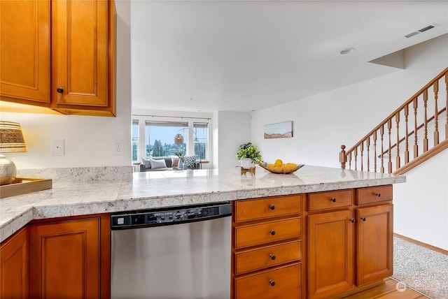 kitchen featuring dishwasher and kitchen peninsula