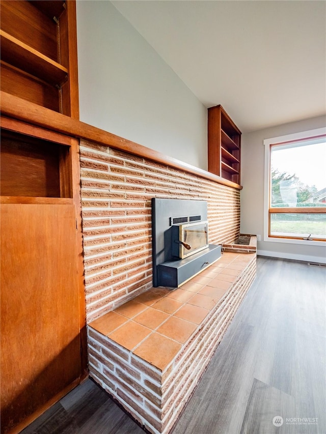 unfurnished living room with wood finished floors