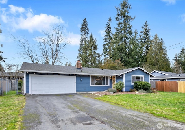 single story home featuring a garage, a front yard, fence, and driveway