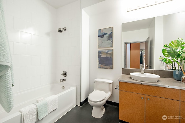 full bathroom with tiled shower / bath combo, vanity, and toilet