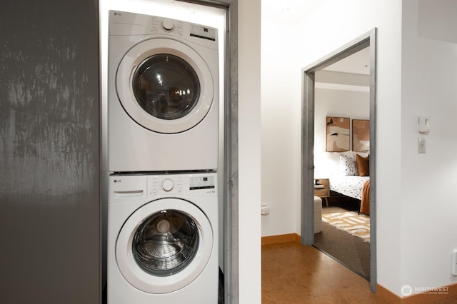 laundry room featuring stacked washer and clothes dryer