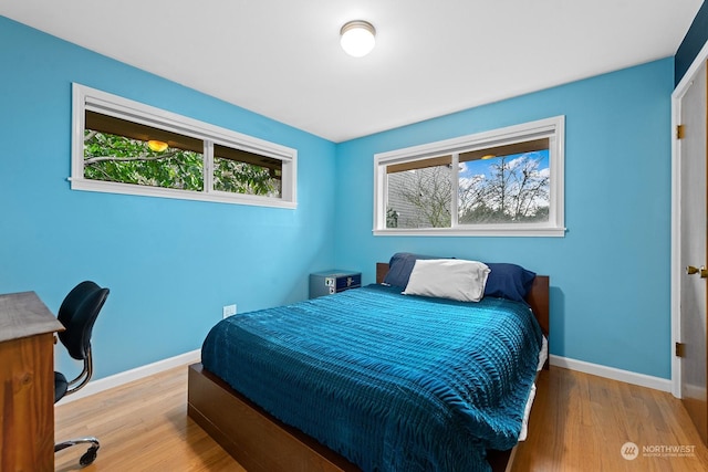 bedroom featuring wood-type flooring