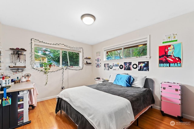 bedroom with hardwood / wood-style flooring