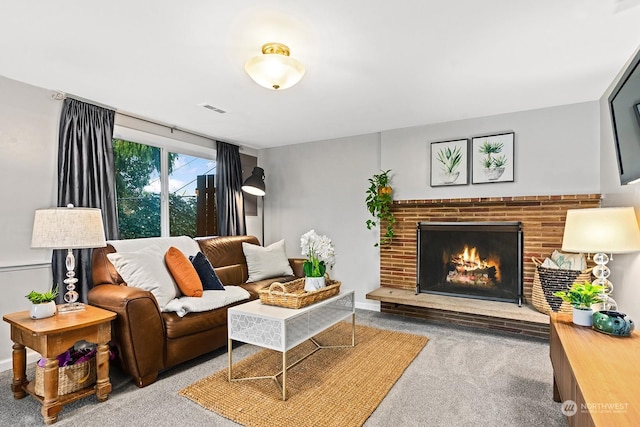 living room featuring a brick fireplace and carpet flooring