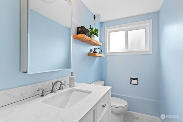 bathroom with vanity and toilet