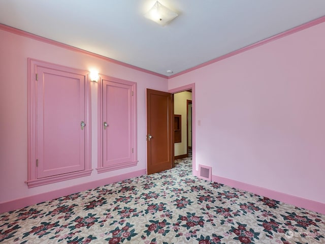 unfurnished bedroom with light colored carpet and ornamental molding