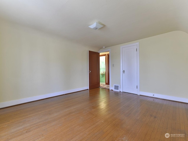 empty room with wood-type flooring