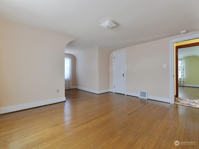 spare room featuring light hardwood / wood-style flooring