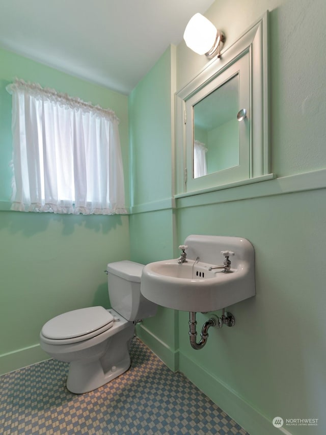 bathroom with sink and toilet