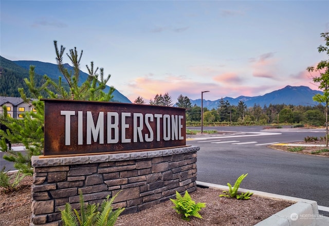 community sign featuring a mountain view