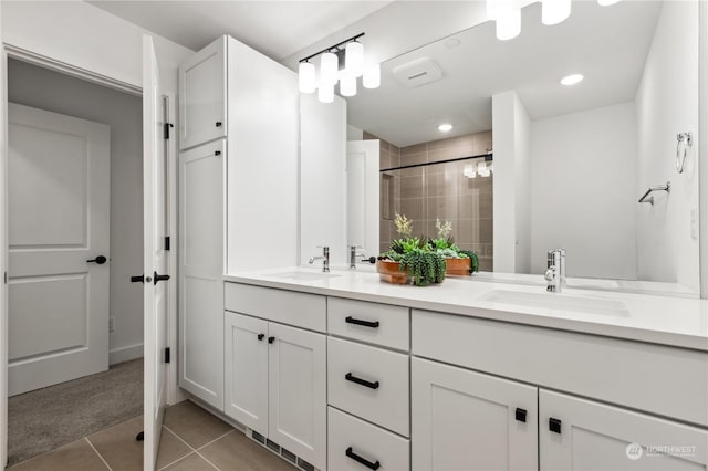 bathroom with vanity, tile patterned floors, and a shower with shower door