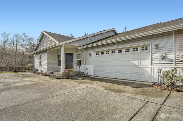 ranch-style home featuring a garage